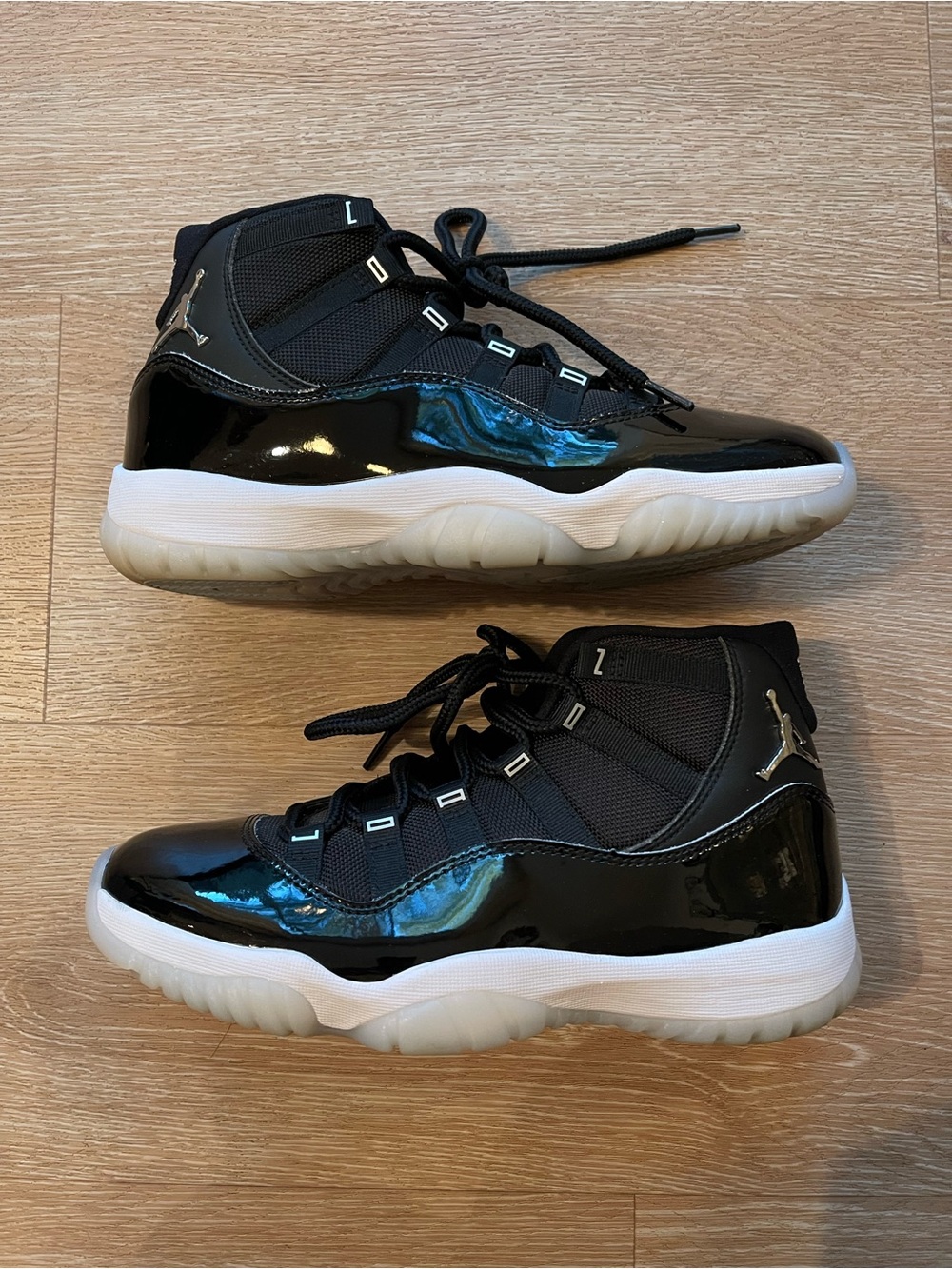 JORDAN 11’s Men’s Black Patent Leather High-Top Sneakers with White Sole